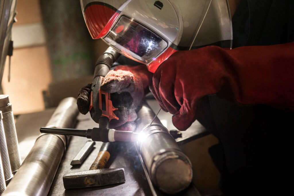 closeup of man wearing mask welding in a workshop 2024 03 27 03 41 23 utc